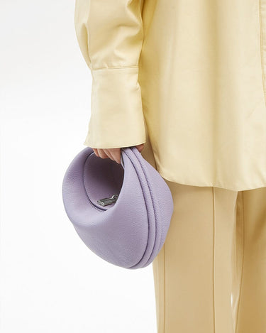 Light purple full-grain leather Luna Bag with silver clasp and adjustable strap