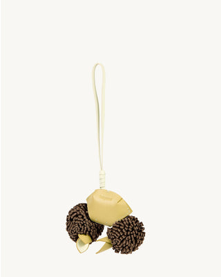Light yellow leather crab charm with brown pom-poms and leaf accents