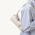 Mini Yore Camera Bag in Cloud, made from vegetable-tanned leather with adjustable strap.