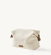 Songmont canvas storage bag with leather details, perfect for cosmetics and travel.