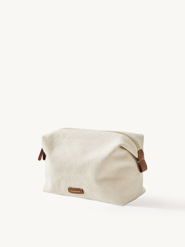 Songmont canvas storage bag with leather details, perfect for cosmetics and travel.