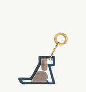 Songmont Puppy Charm: Multicolor leather keychain shaped like a playful dog with gold-tone ring.