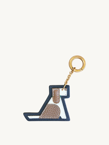 Songmont Puppy Charm: Multicolor leather keychain shaped like a playful dog with gold-tone ring.