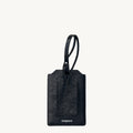 Black leather Songmont luggage tag with clear ID window and loop