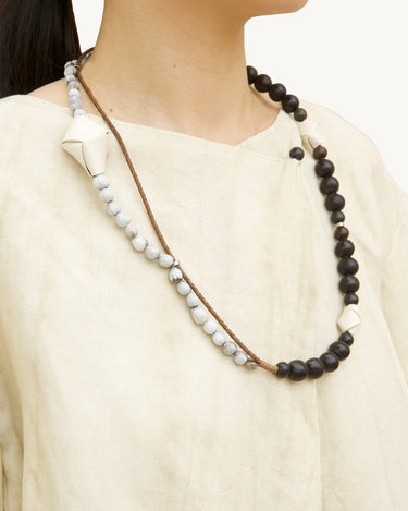 Large Carefree Thread Charm necklace: sandalwood, light stone beads, white leather diamond charm.