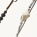 Large Carefree Thread Charm in Sandal: alternating seed and sandalwood beads with cream leather diamond and metal ring