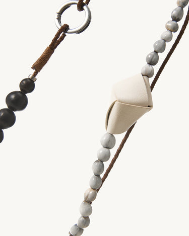 Large Carefree Thread Charm in Sandal: alternating seed and sandalwood beads with cream leather diamond and metal ring