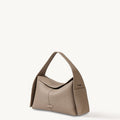 Drippy Roof Bag in taupe pebble leather with structured silhouette and single strap.