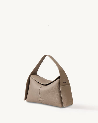 Drippy Roof Bag in taupe pebble leather with structured silhouette and single strap.