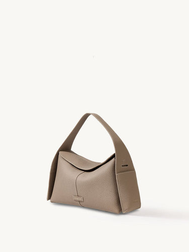 Drippy Roof Bag in taupe pebble leather with structured silhouette and single strap.