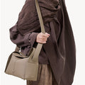 Cobble Drippy Roof Bag: textured leather shoulder bag with structured design for urban chic.