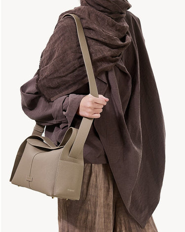 Cobble Drippy Roof Bag: textured leather shoulder bag with structured design for urban chic.