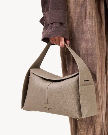 Songmont Drippy Roof Bag in Cobble textured leather, a modern tote with flap closure.