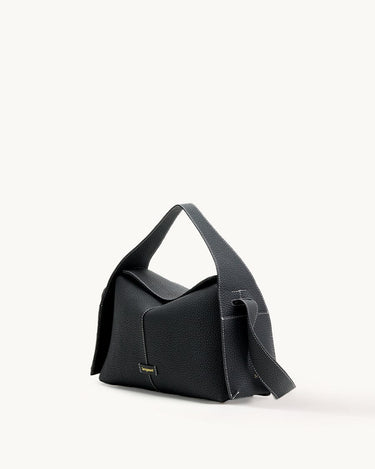 Black full-grain leather Drippy Roof Bag with flap closure and white stitching. Features gold "Songmont" logo.