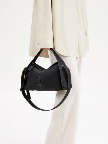 Black pebbled leather Drippy Roof Bag with white stitching, adjustable strap, and 'Songmont' logo