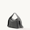 Textured charcoal grey leather Drippy Roof Bag with white stitching and golden Songmont logo.