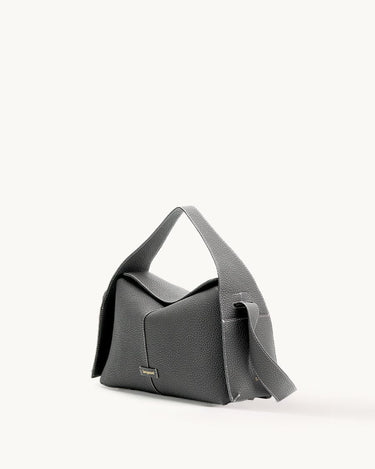 Textured charcoal grey leather Drippy Roof Bag with white stitching and golden Songmont logo.