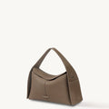Taupe Drippy Roof Bag in pebbled full-grain leather with a structured silhouette and adjustable strap.