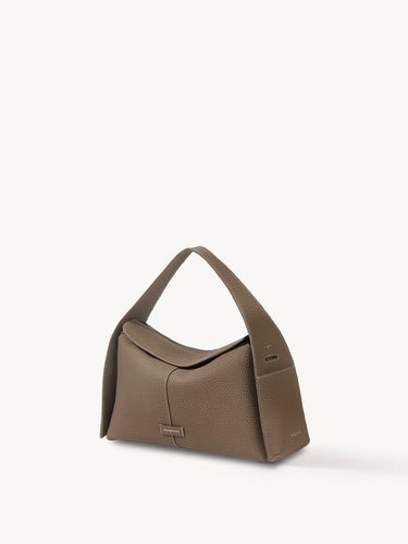 Taupe Drippy Roof Bag in pebbled full-grain leather with a structured silhouette and adjustable strap.