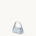 Light blue pebbled leather Mini Drippy AirPods Case with a short handle and a snap closure.