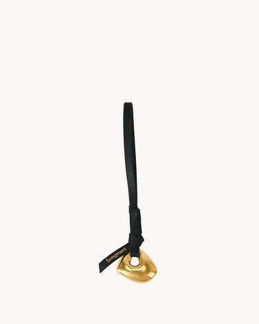 Faith Stone Charm in onyx with gold pendant and black leather strap, featuring 'Songmont' logo.