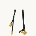 Faith Stone & Prayer Wheel Charm set: gold metal charms on black leather with 'Songmont' logo.