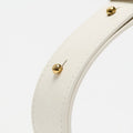 Gather Clutch Set in Cloud: White leather strap with gold studs and contrast stitching.