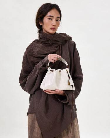 Gather Clutch Set in Cloud color, crafted from Nappa leather with a unique two-tone effect and fabric lining.