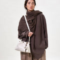 Gather Clutch Set in Cloud: Soft Nappa leather bag with contrast tone details and adjustable strap.