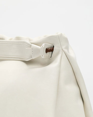 Gather Clutch Set in Cloud: Soft white nappa leather bag with braided detail and adjustable strap.
