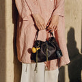Gather Clutch Set in ebony leather with yellow gourd charm
