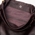 Ebony Gather Clutch Set interior with quilted lining and zipper detail.