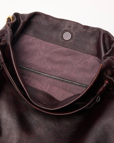 Ebony Gather Clutch Set interior with quilted lining and zipper detail.