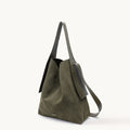 Olive green large drippy tote bag with adjustable strap and side pocket.