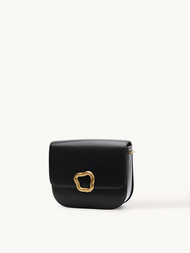 Large Reset Tofu Bag in Onyx black calf leather with gold-finish vintage Wonton ring detail.
