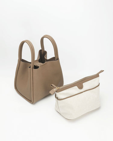 Large taupe Song bag with cream canvas pouch, full-grain leather, magnetic closure.