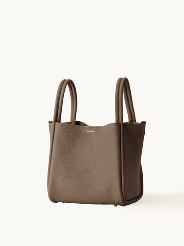 Taupe full-grain leather Large Song Bag with double top handles and subtle gold-tone hardware.