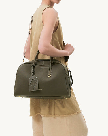 Large Yore Bowling Bag in Moss green full-grain leather with diamond motif tag and gold hardware.