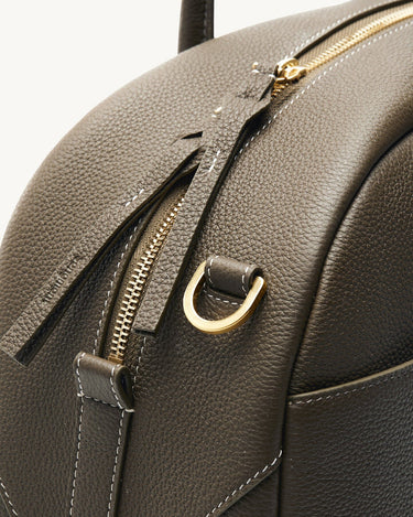 Large Yore Bowling Bag in moss green full-grain leather with gold zipper and white stitching