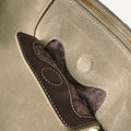 Close-up of Large Yore Hobo Bag in Dune Suede, showing stitching detail and gold hardware.