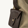 Large Yore Hobo Bag in Dune Suede with a contrasting dark brown leather pocket and gold clasp.