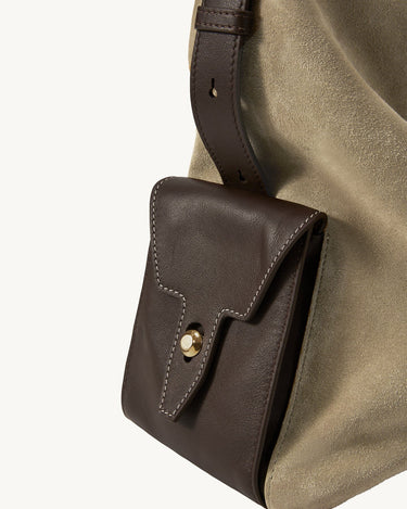 Large Yore Hobo Bag in Dune Suede with a contrasting dark brown leather pocket and gold clasp.