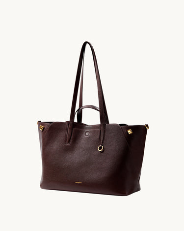 Large Yore Tote Bag in Raisin color, made of pebble-grained leather with gold hardware.