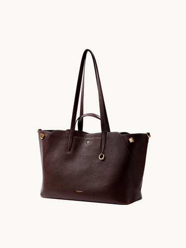 Large Yore Tote Bag in Raisin color, made of pebble-grained leather with gold hardware.