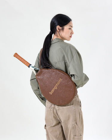 Brown vegetable-tanned leather tennis racket cover with "Songmont" embossed