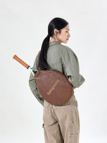 Brown vegetable-tanned leather tennis racket cover with "Songmont" embossed