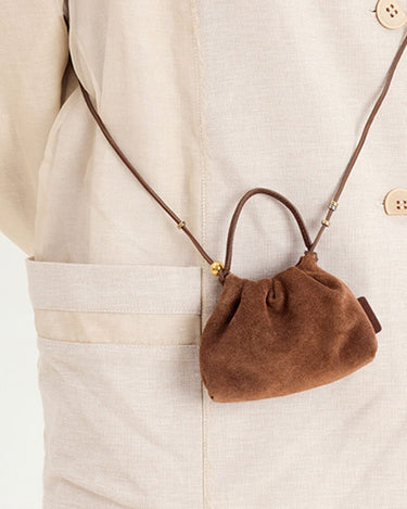 Brown suede Lucky Pouch Charm with drawstring, cow suede leather, 11cm dimensions, on adjustable strap.