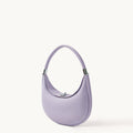Lavender full-grain leather Luna Bag with silver hardware, crescent shape and adjustable strap.