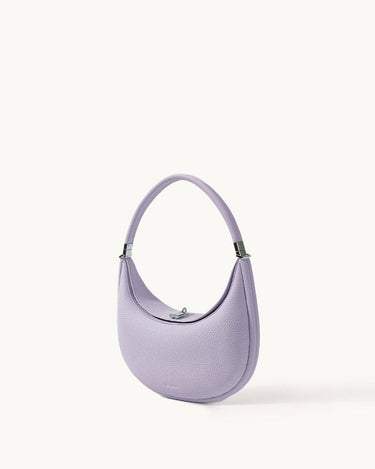 Lavender full-grain leather Luna Bag with silver hardware, crescent shape and adjustable strap.