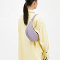 Lavender full-grain leather Luna Bag worn on shoulder